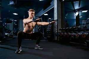 The man performs a variety of squat exercises.