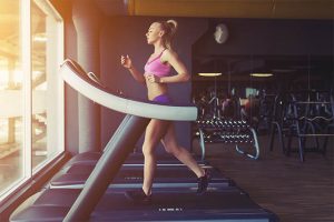 The woman exercises daily on the treadmill.
